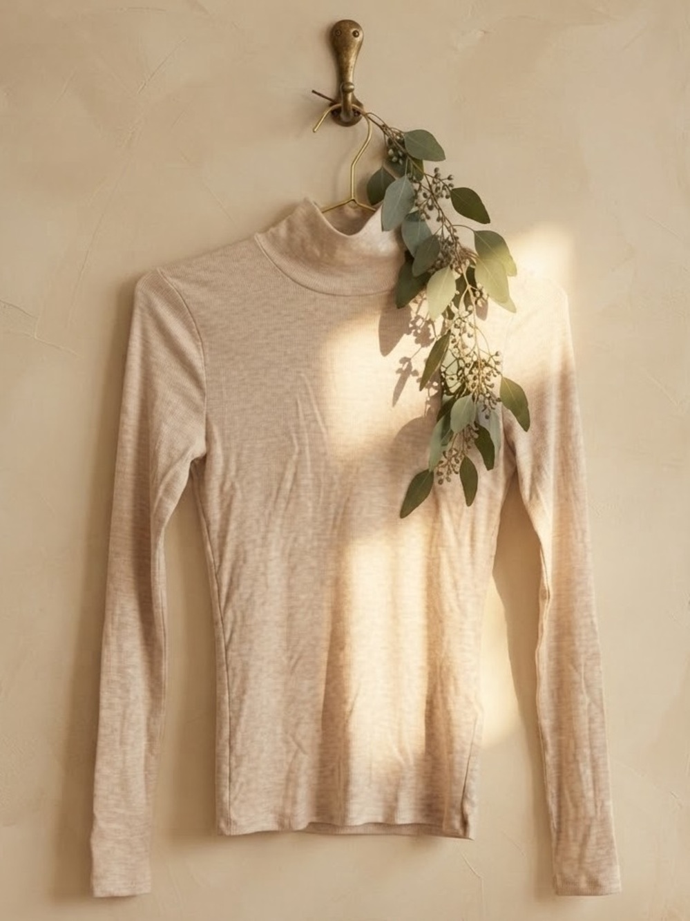 Aritzia Ribbed Long Sleeve Mock Neck Top in marled cream tan